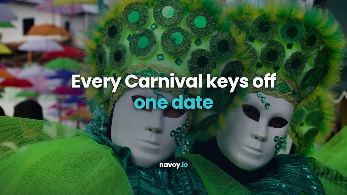 Two carnival performers in green feathered headdresses and white masks at a street parade