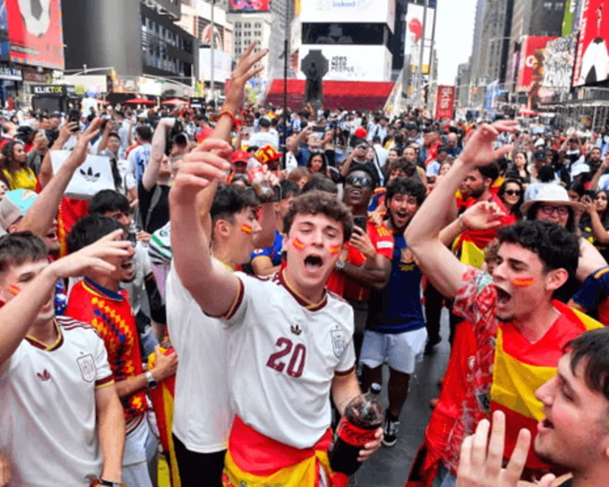 Spain fans celebrating the 2026 World Cup win in a Madrid plaza