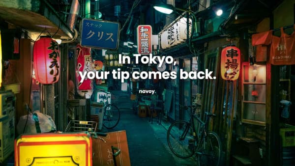 A lantern-lit izakaya alley in Tokyo at night - in Japan, a tip left behind usually comes back to you